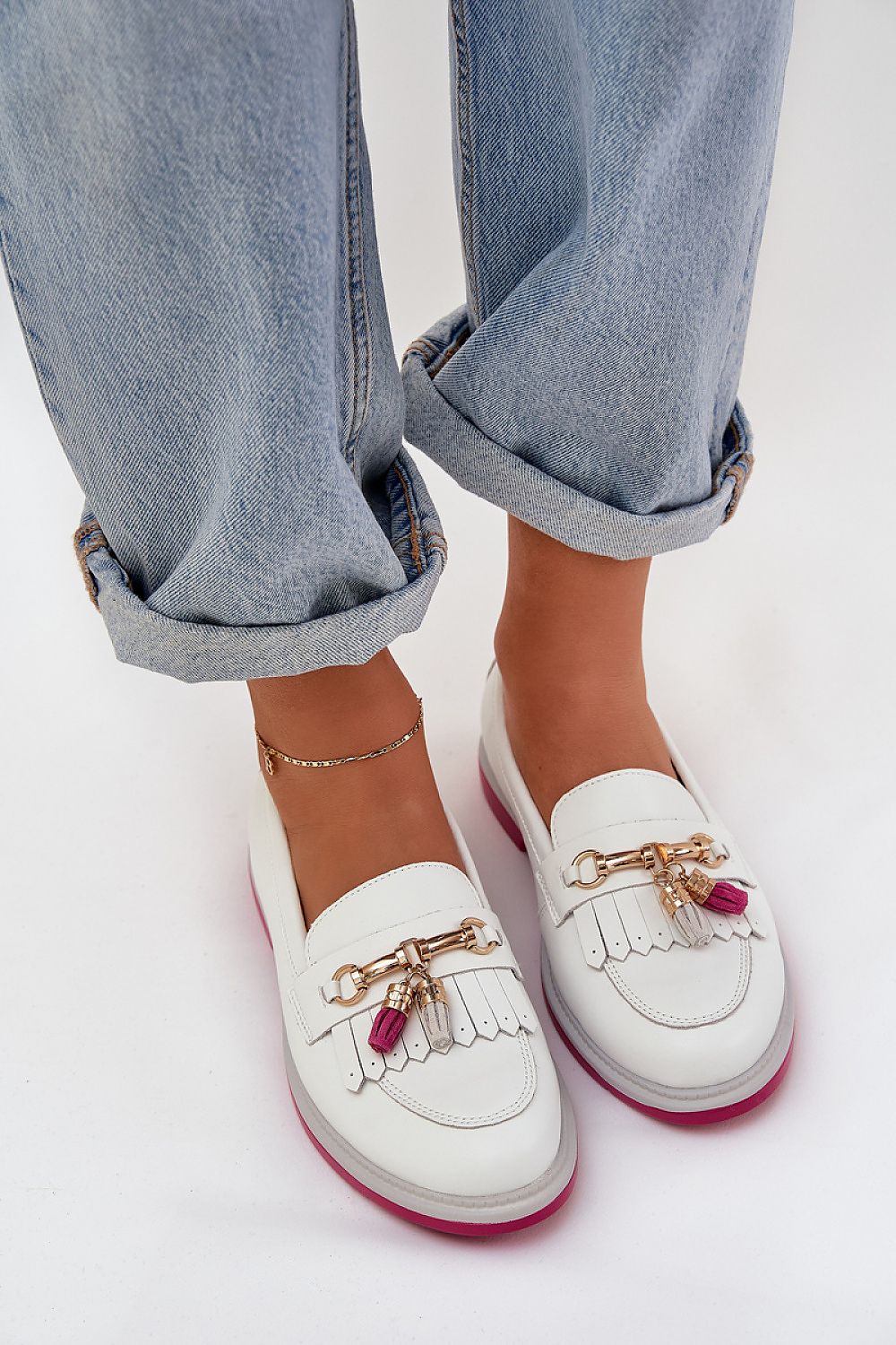 Stylish women's moccasins by Step in style, made from luxurious natural leather with a charming decorative element.