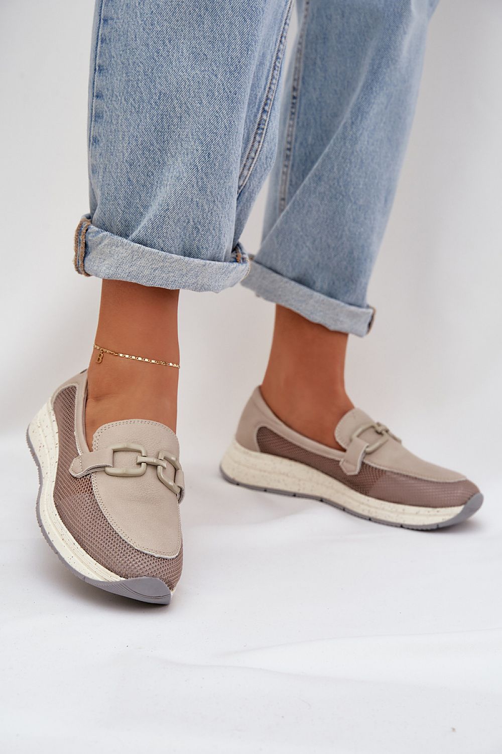 Elegant perforated leather loafers with wedge heel from Step in Style, showcasing breathable comfort, delicate buckle detail, and perfect for stylish women.