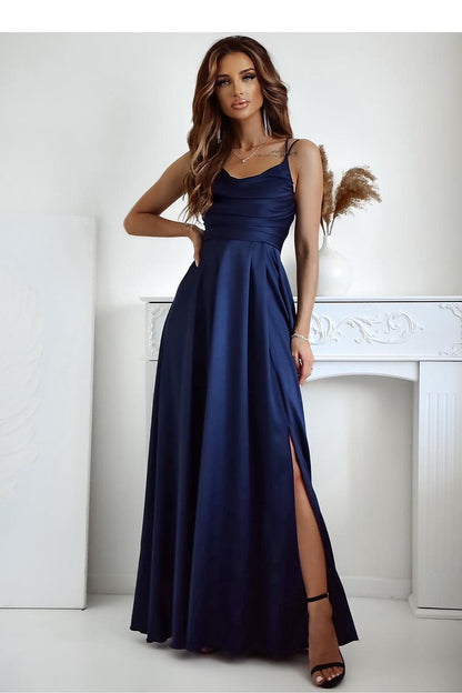 Elegant long dress with slit and water neckline by With You, showcasing a braided tie back.