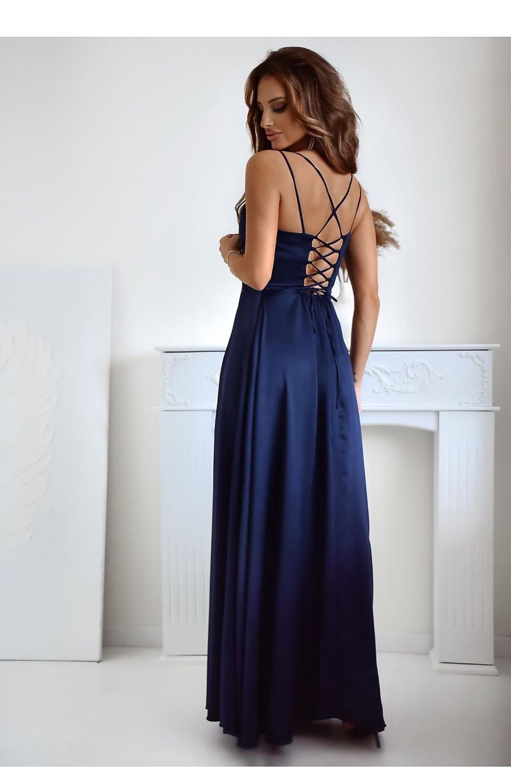 Sophisticated long dress designed by With You, featuring a side slit and delicate thin straps.