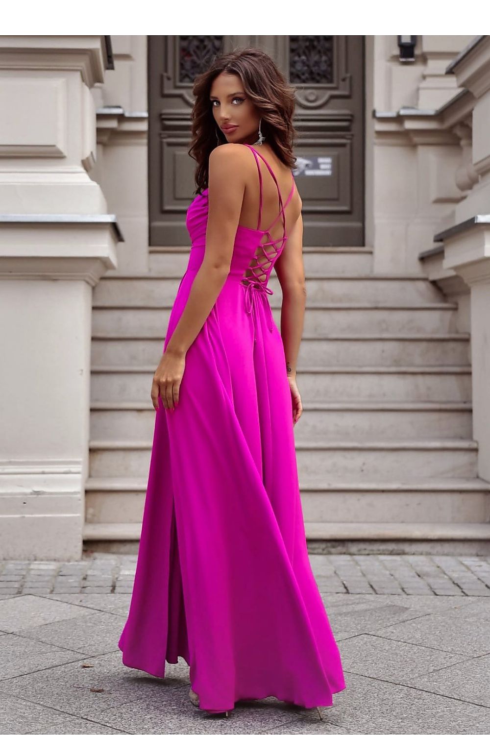 Chic long dress presented by With You, highlighting a stylish side slit and a braided tie detail.