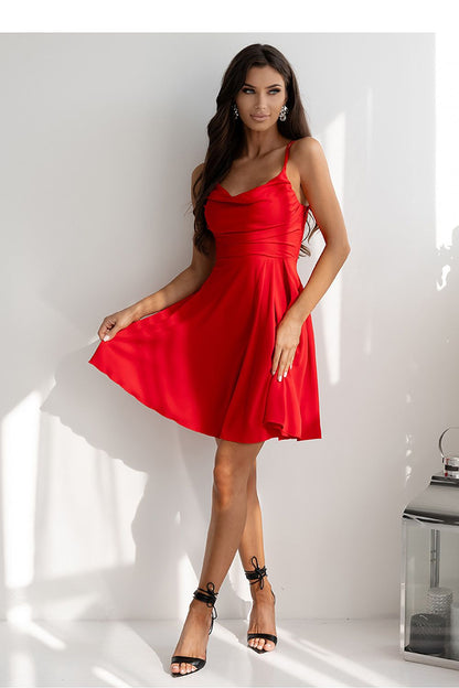 Stylish flared bottom dress from With You, crafted from smooth flowing fabric with elegant thin straps.