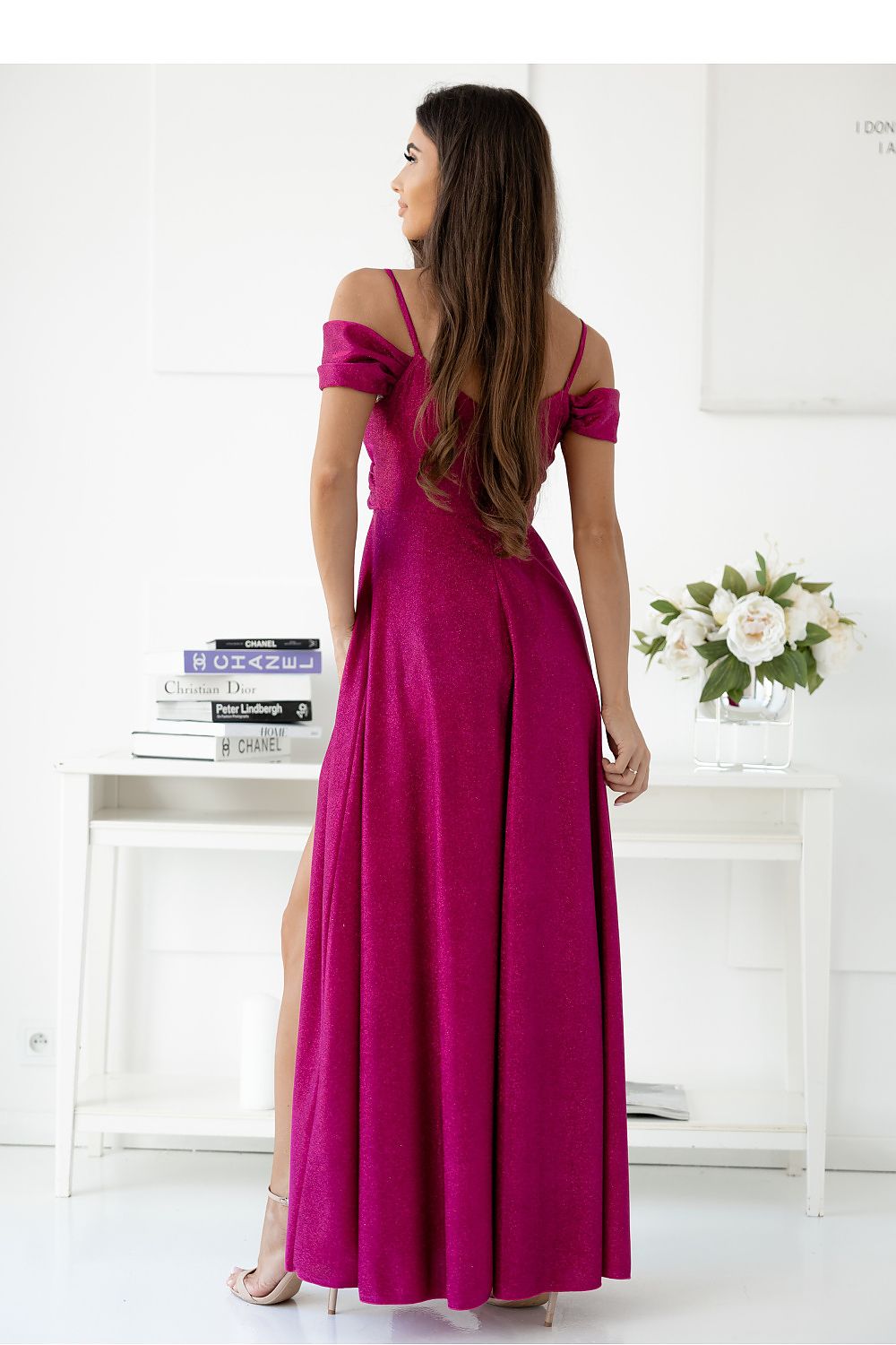 Elegant long dress with a thigh-high slit and flowy material by With You, perfect for formal occasions.