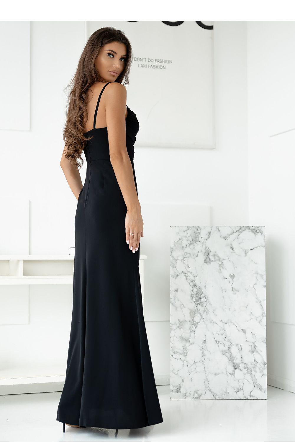 High-quality adjustable strap long dress by With You, showcasing a fitted silhouette and sophisticated deep v-neck design.