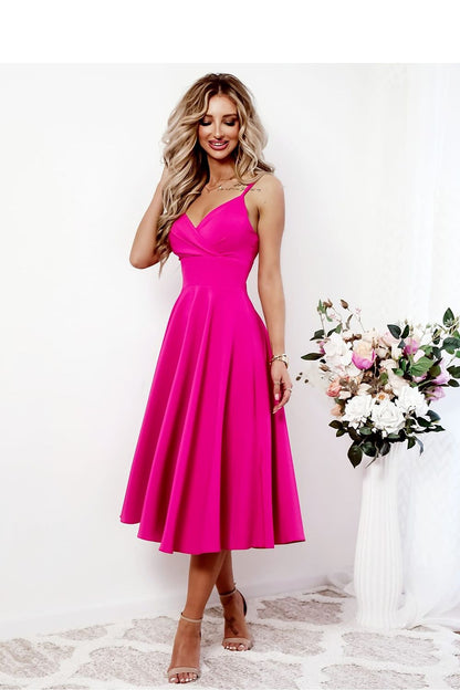 Close-up of the fabric and intricate design details of the With You evening dress with a deep wrap neckline.