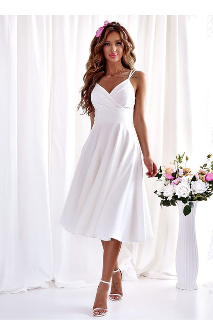 Stylish dress by With You with a dramatic front slit and flattering fit, perfect for weddings and upscale parties.