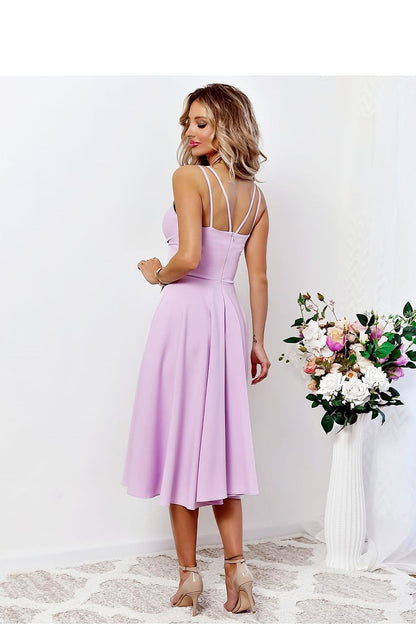 With You elegant evening dress showcasing long straps and a flattering cut under the bust, ideal for formal events.
