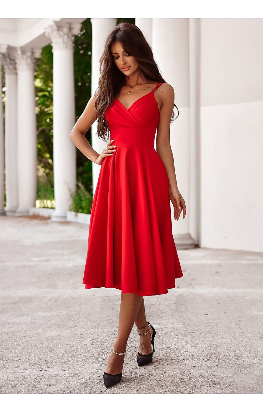 Model wearing the flared slit 7/8 length evening dress by With You, showcasing its sophisticated silhouette.