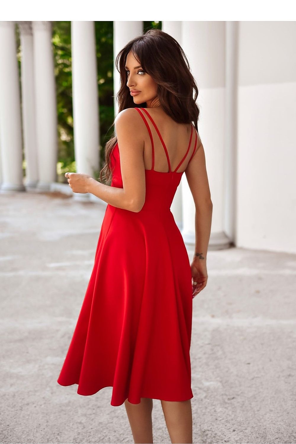 Side view of the elegant 7/8 length evening dress with a deep wrap neckline and high slit from With You.