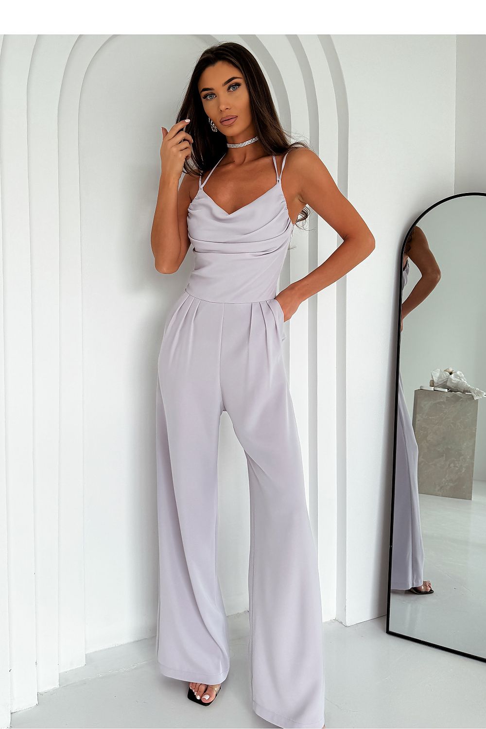 Elegant women’s jumpsuit by With You, featuring thin straps, decorative pleats, and practical slip pockets, available in sizes EU 34-40, perfect for chic occasions.