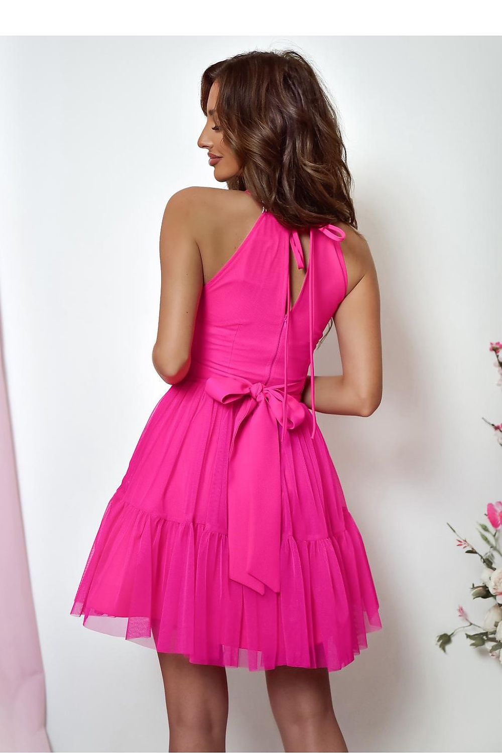 Model wearing the With You elegant tulle dress at an evening event, exemplifying timeless elegance and adjustable straps for a perfect silhouette.