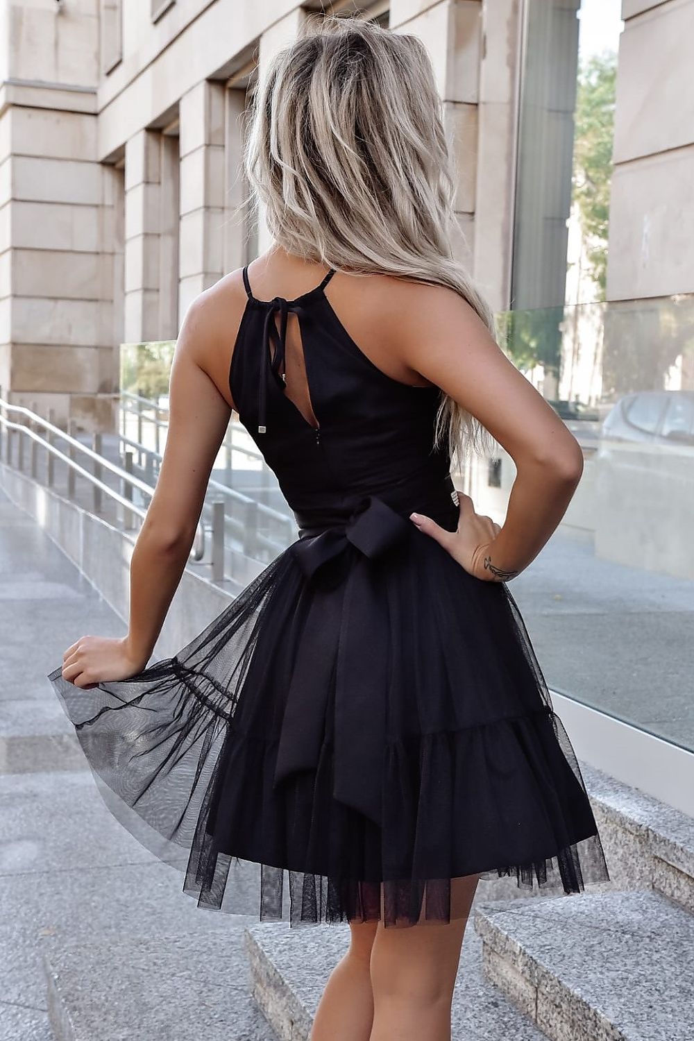 Flared tulle evening dress by With You with decorative belt and slightly flared bottom, showcasing exquisite craftsmanship for stylish occasions.