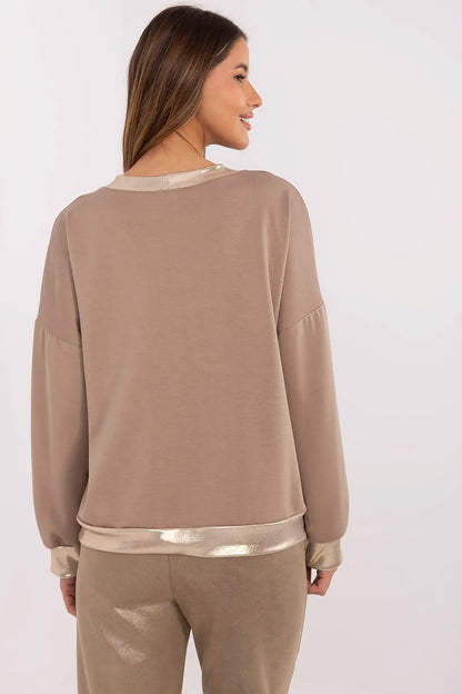 Close-up detail of the luxurious gold button closure and cuffs on the Italy Moda V-Neck Blouse, showcasing sophistication and style.