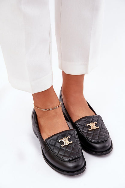 Stylish view of Step in Style's elegant women's moccasins made from high-quality natural leather, showcasing intricate stitching and luxurious gold accents.