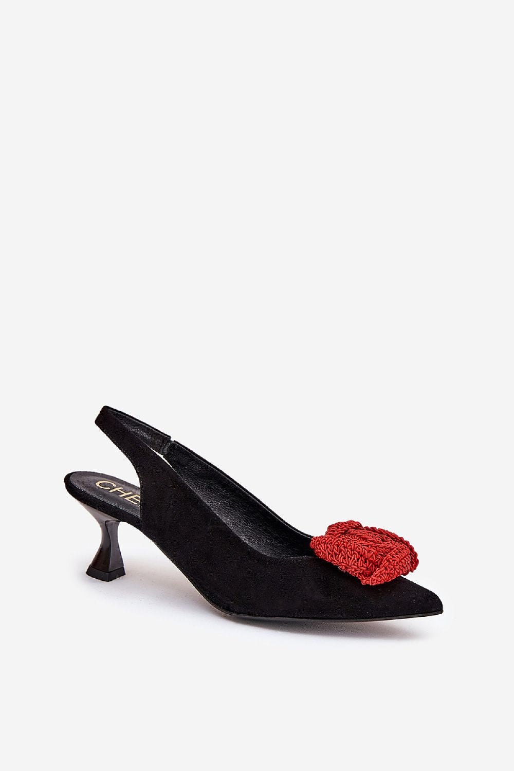 Close-up of Step in Style's luxurious suede pumps showcasing the delicate rose embellishment on the pointed toe.