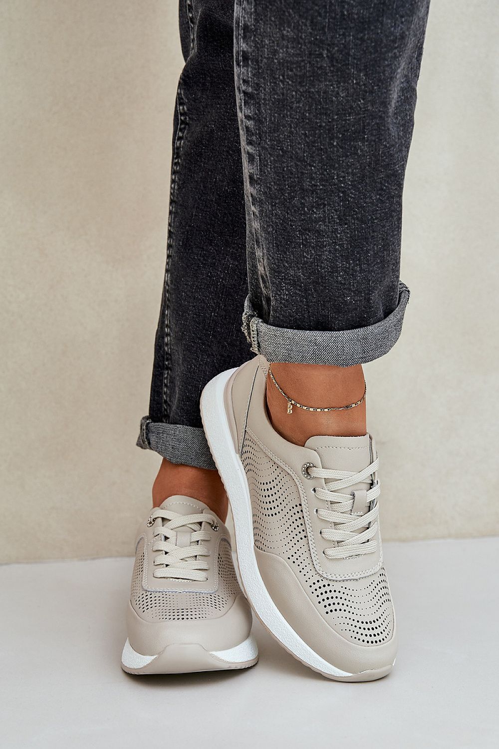 Step in Style's elegant women's sports shoes crafted from natural leather, showcasing a stylish laced design and a comfortable insole for all-day wear.