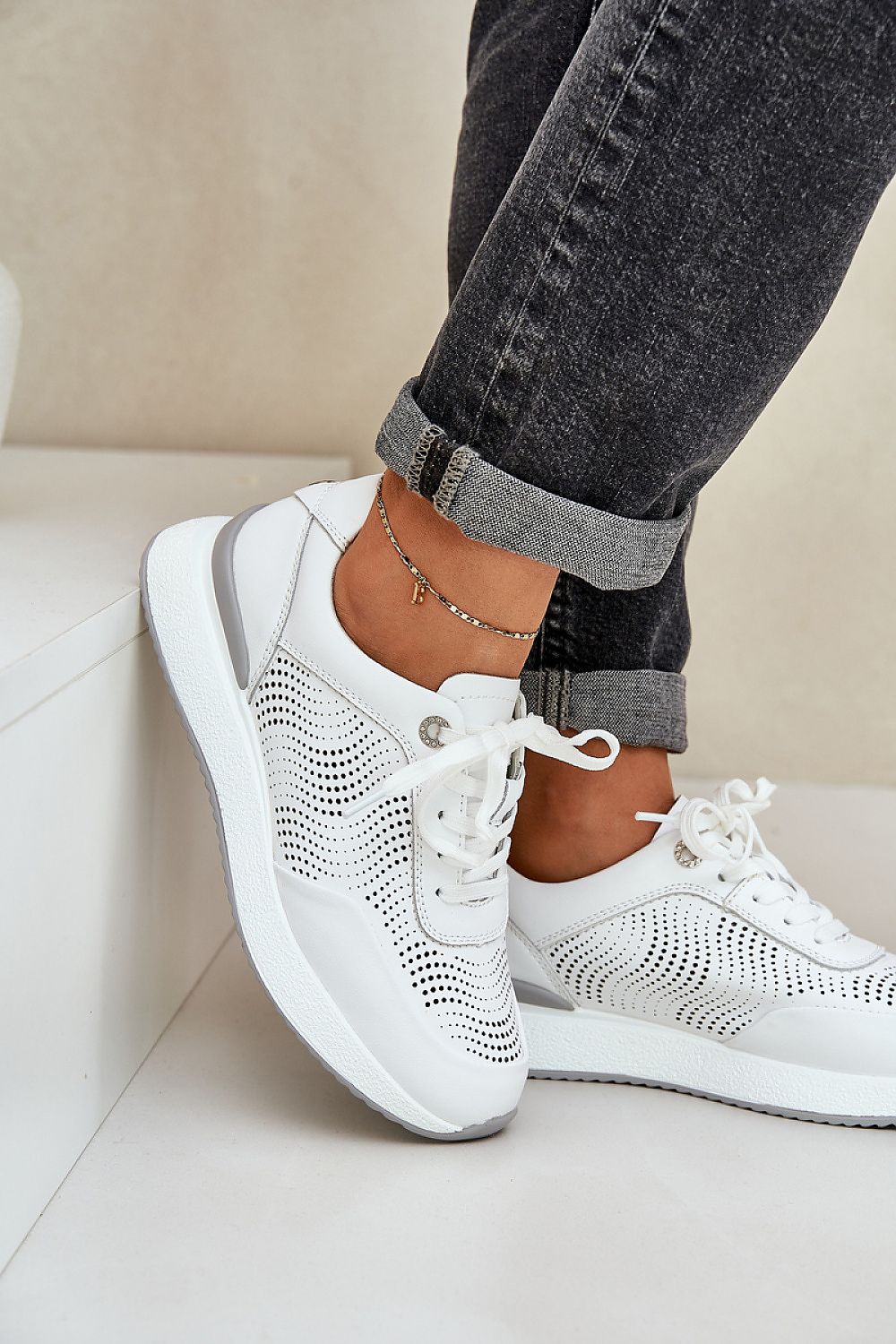 Step in Style presents these exquisite women's natural leather sports shoes, blending style and comfort with their elegant lacing and cushioned footbed.