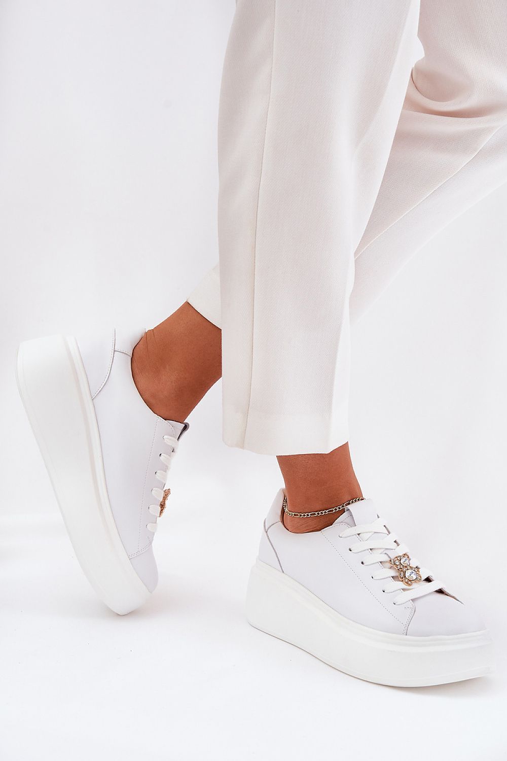 Luxury women's platform sneakers in natural leather by Step in Style, featuring a unique teddy bear charm, ideal for stylish comfort.