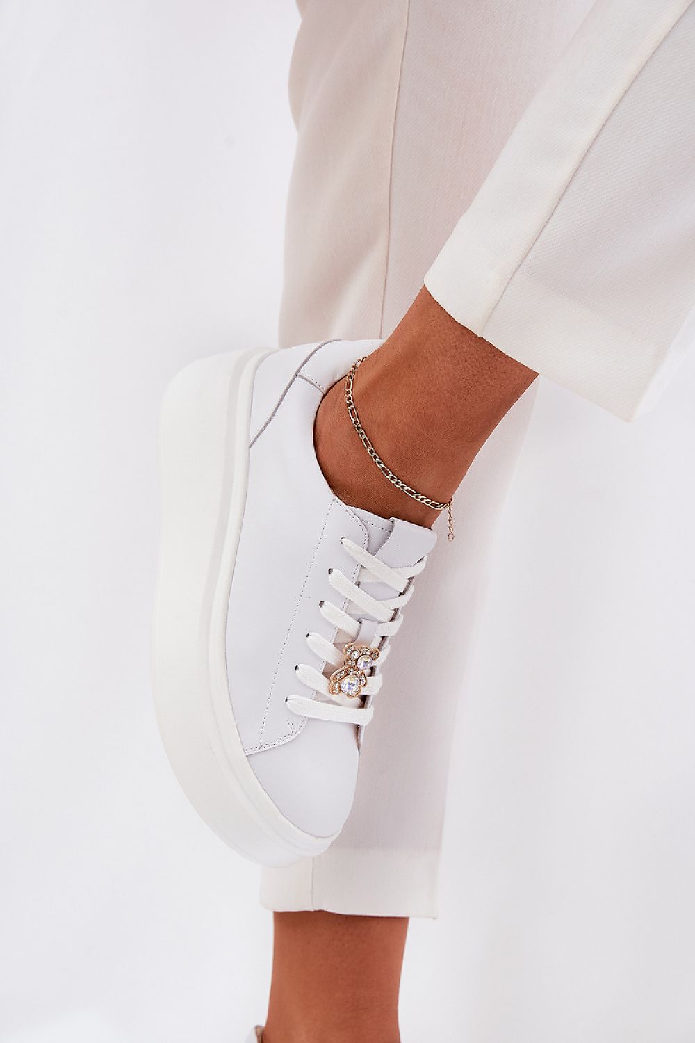 Luxury women's platform sneakers in natural leather featuring a stylish teddy bear charm, designed by Step in Style.
