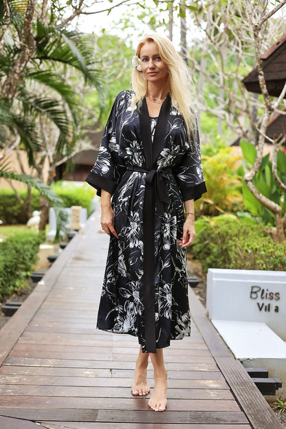 Kalimo satin bathrobe nightgown displayed in an opulent setting, exemplifying comfort and style, ideal for a sophisticated night in.