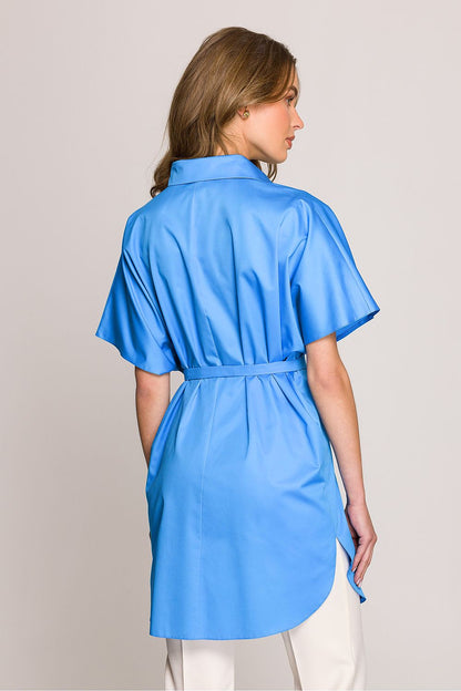 A stylish model wearing the oversized short sleeve cotton tunic shirt by Stylove, demonstrating its comfortable fit.