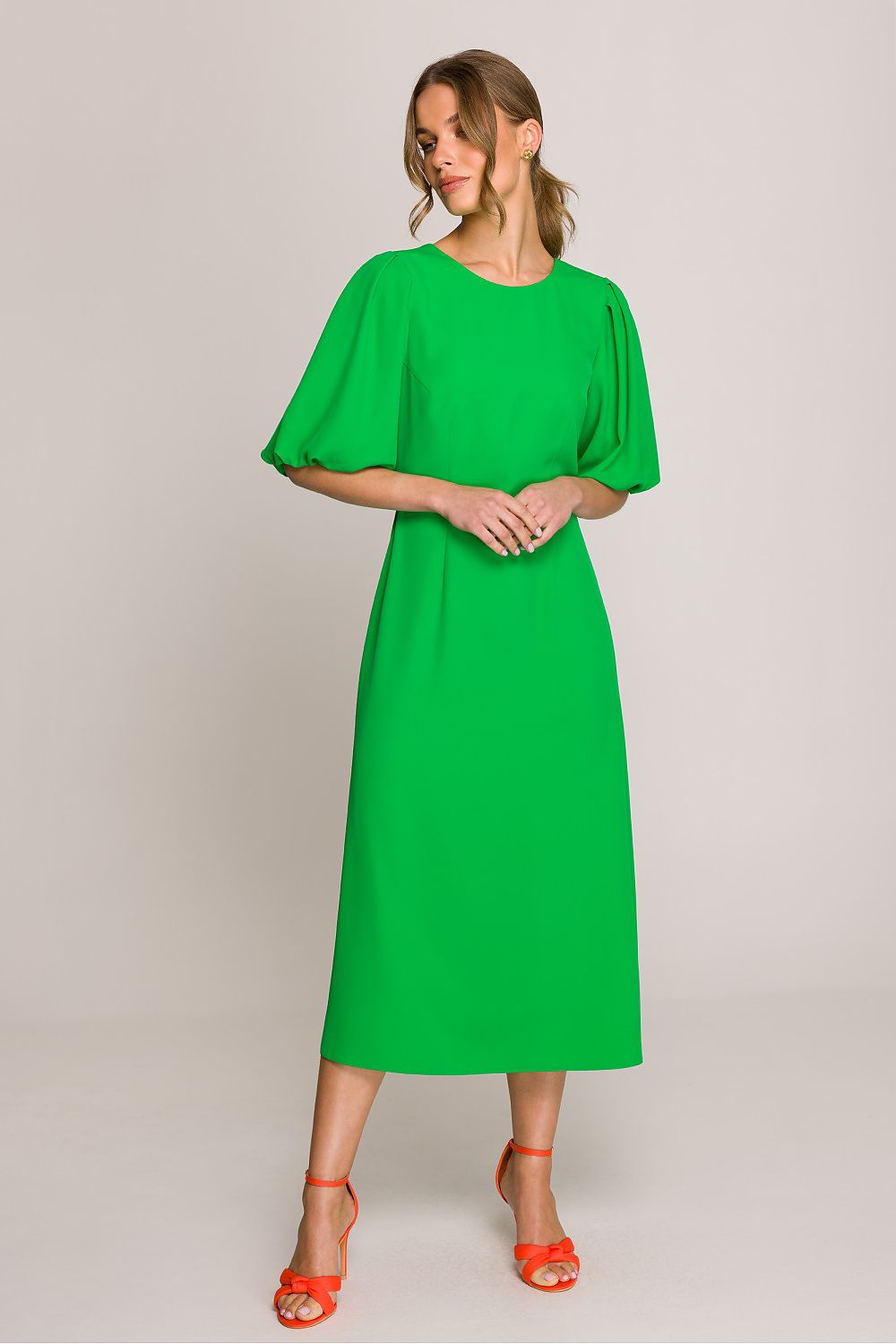 Stylove midi dress in a graceful flow, designed with a subtle V-shaped back for an elegant finish.