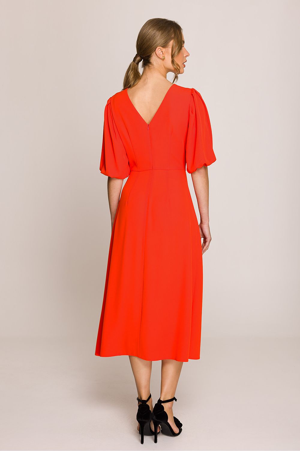 Luxurious Stylove midi dress showcasing a subtly flared design, detailed with a V-shaped back cut for refined style.