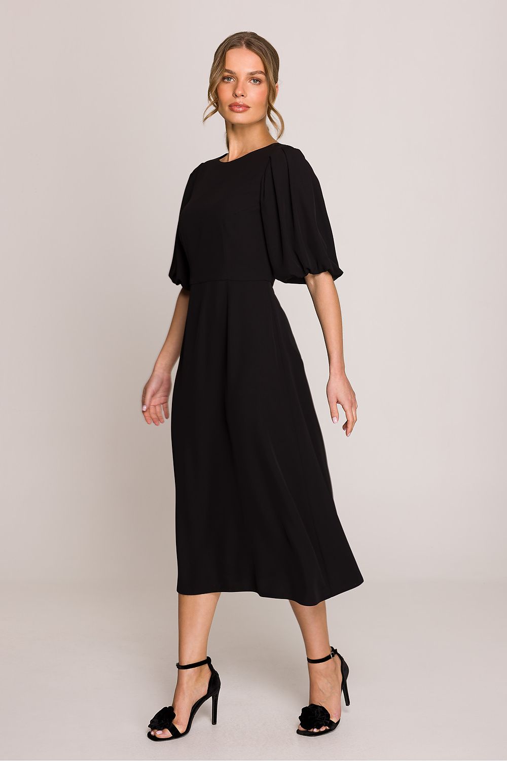Stylove midi dress in sizes S-XL, featuring a comfortable fit and chic puff sleeves, ideal for chic day-to-night transitions.