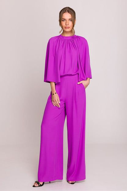 Stylove wide kimono sleeve jumpsuit in a graceful pose, highlighting the sophisticated ruching and back slit feature, ideal for stylish outings.