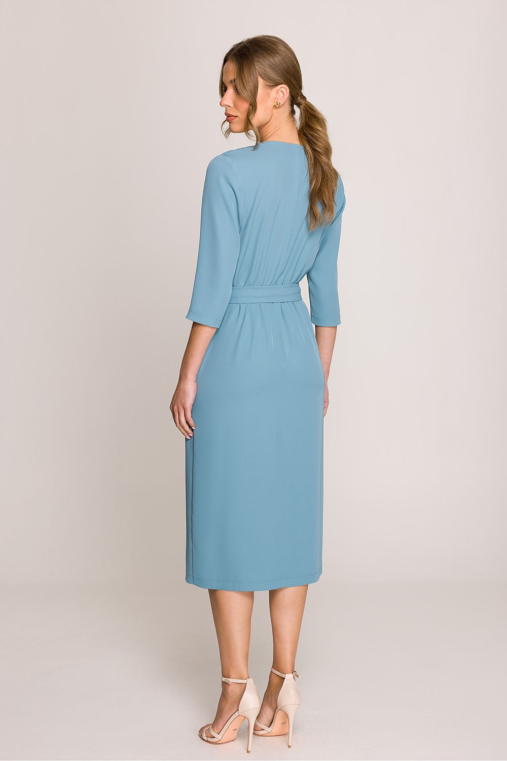 Stylove Elegant Midi Dress displayed from the back, featuring a classic V-neckline and flattering wrap motif for movement.