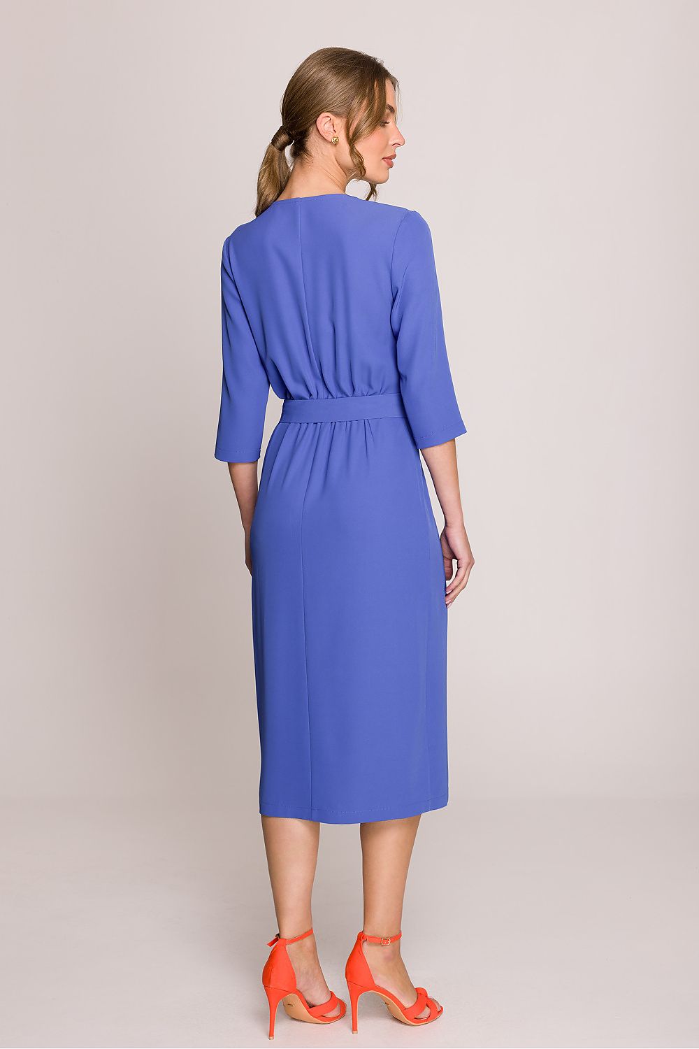 Stylove feminine midi dress with a wrap motif at the bottom, offering freedom of movement and a flattering fit for the figure.