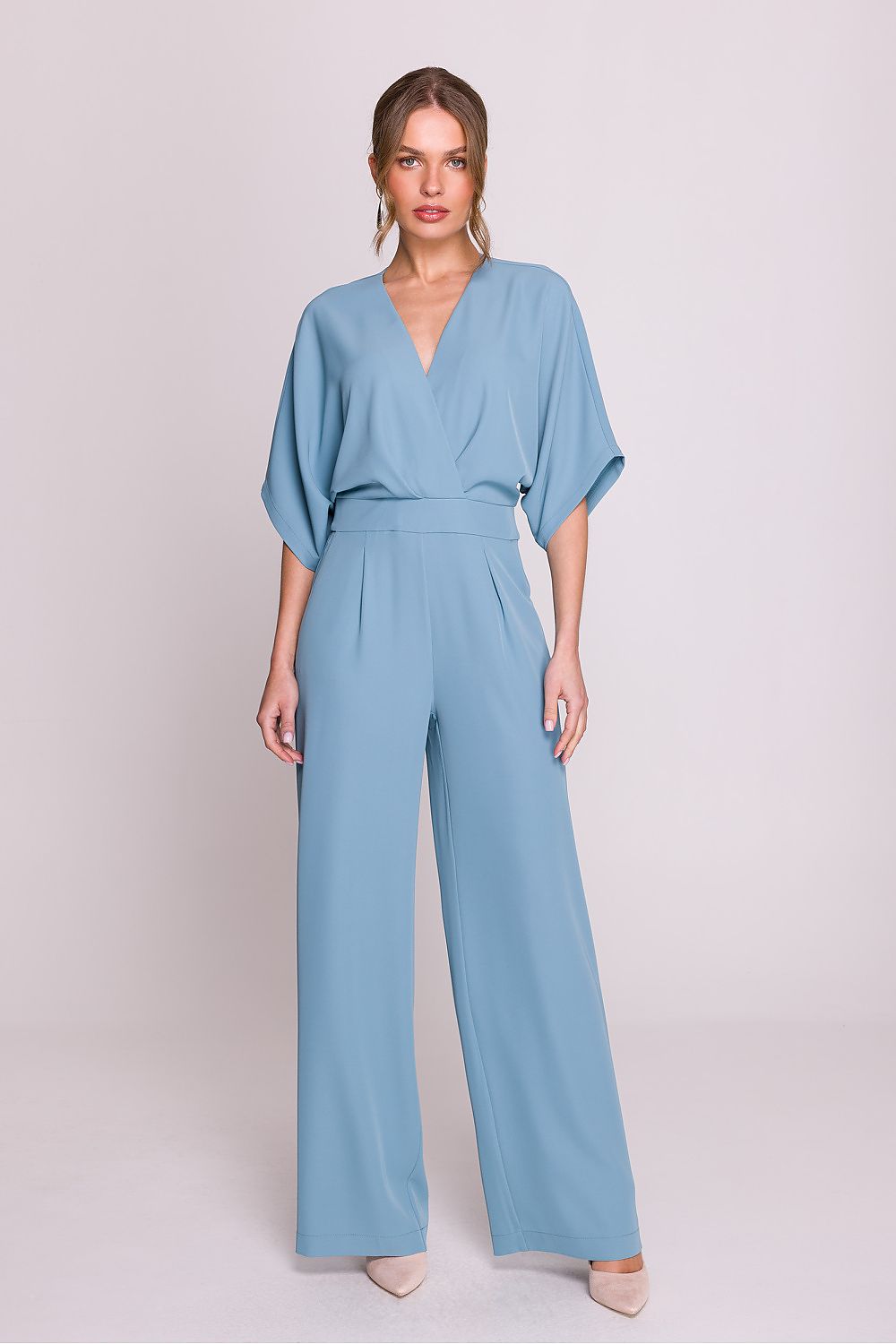 Elegant women's jumpsuit by Stylove featuring a luxurious wrap top, V-neckline, and side pockets, available in sizes S to XXL.