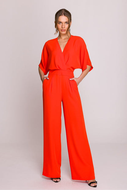 Chic and classy jumpsuit for women by Stylove, designed with practical side pockets and an elegant zipped back.