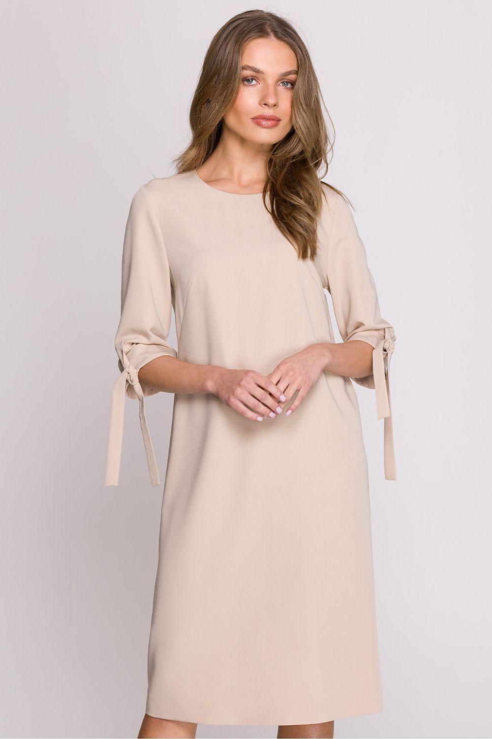 Chic model wearing the Elegant A-Line Daydress by Stylove, demonstrating its flattering knee-length design.