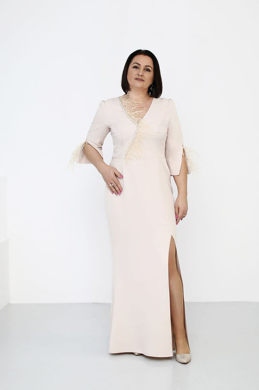 Elegant maxi evening dress with feathers and cutout sleeves by Jersa, perfect for special occasions, showcasing a fitted silhouette and luxurious design.