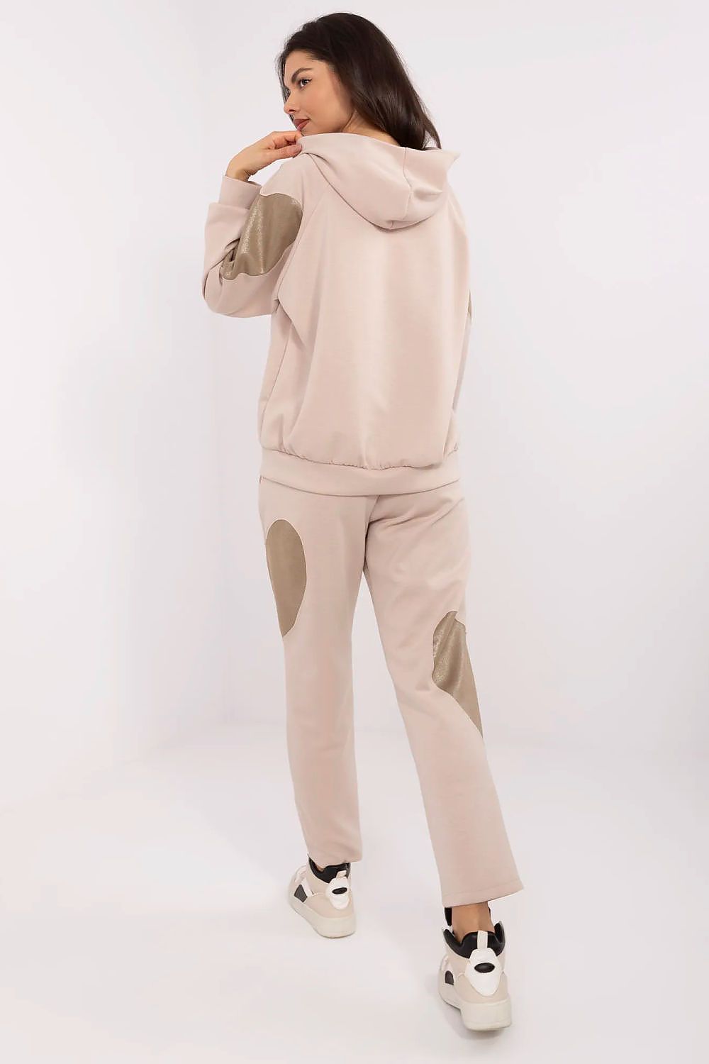 Italy Moda luxury tracksuit ensemble displayed, highlighting the unique heart-shaped patches on sleeves and pants, designed for relaxed yet fashionable wear.
