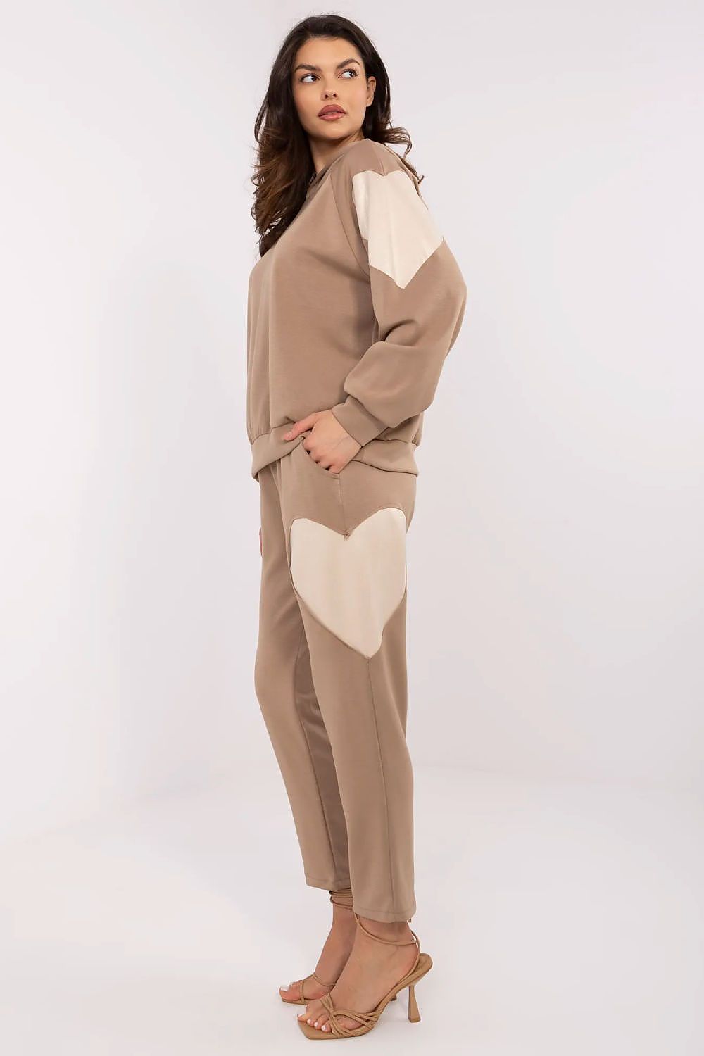 Italy Moda model wearing the luxury tracksuit set, radiating comfort and sophistication, perfect for at-home lounging or casual outings.
