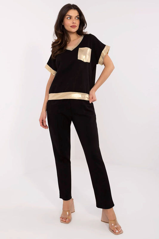 Luxury women's set by Italy Moda featuring a stylish V-neck blouse and high-waisted trousers, showcasing elegant golden accents for an upscale look.