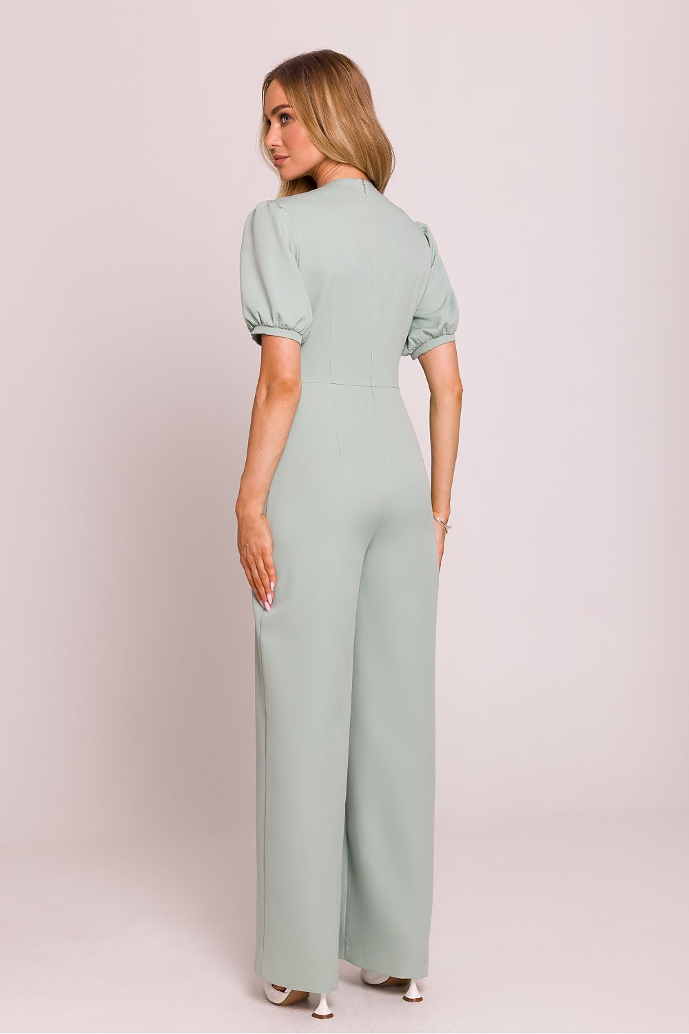 Elegant Moe Women's Jumpsuit in luxurious fabric featuring a deep V-neck and flattering flared trousers. Ideal for chic occasions.