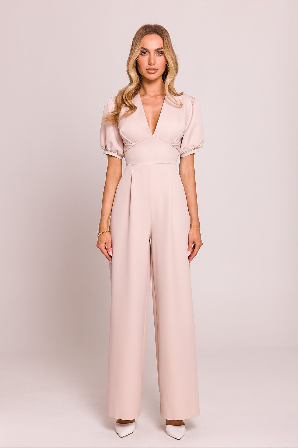 Close-up of Moe Women's Jumpsuit showcasing the intricate details of the short puffy sleeves and accentuated waist for a sophisticated silhouette.