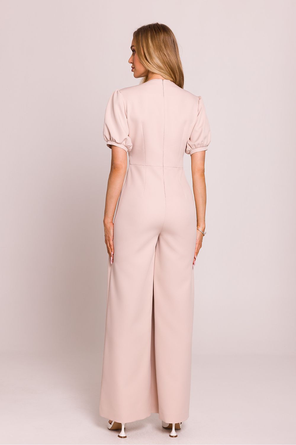 The back view of the Moe Women's Jumpsuit, highlighting the concealed zipper and elegant design crafted for comfort and style.