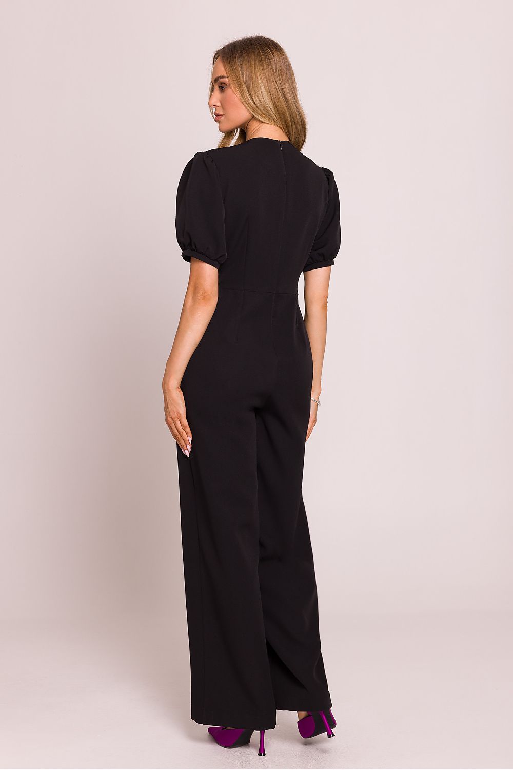 Stylish Moe jumpsuit with romantic short puffy sleeves and a concealed zipper, designed for a sophisticated look.