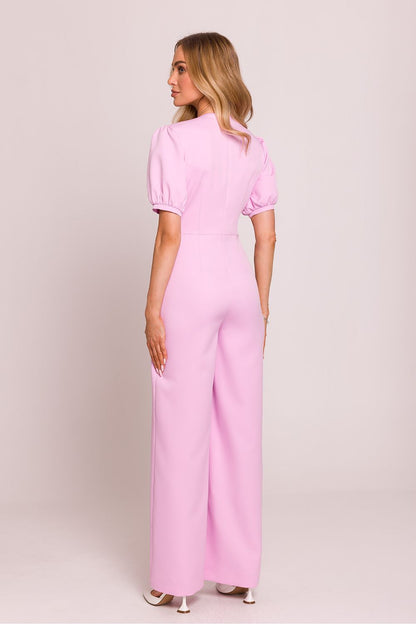 Elegant model wearing Moe jumpsuit, emphasising feminine silhouette and perfect fit in luxurious fashion.