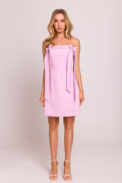 Model wearing the Moe mini cocktail dress in a chic setting, emphasizing its sophisticated and flattering fit.