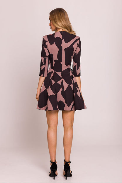 Flared bottom of Moe's enchanting V-neck mini dress, highlighting lightweight fabric and sophisticated design.