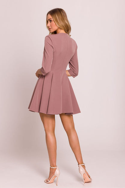 Sophisticated mini dress by Moe designed in Poland, highlighting a unique silhouette and elegant detailing.