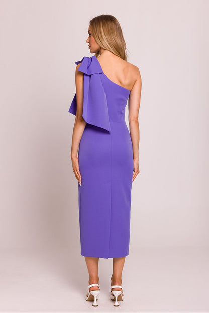 Elegant asymmetrical cocktail dress by Moe, showcasing a stunning high slit and unique bow design, perfect for a luxurious evening look.