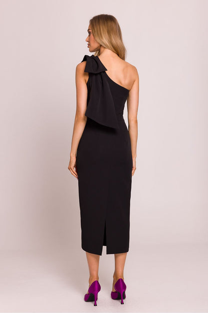 Stylish flat lay presentation of Moe's asymmetrical cocktail dress, showcasing its luxurious fabric and exquisite craftsmanship ideal for elegant celebrations.