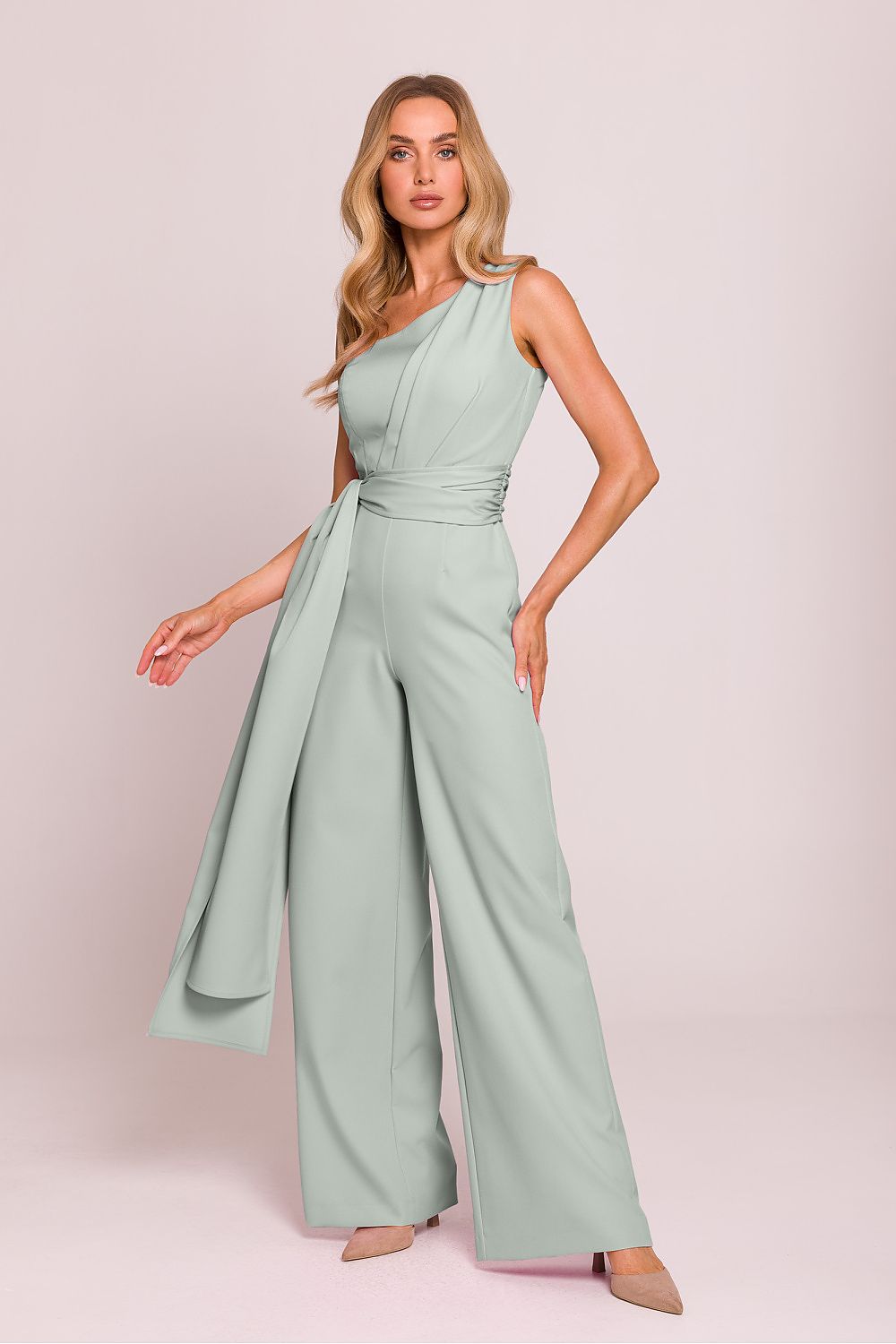 Model wearing an elegant asymmetrical jumpsuit by Moe, demonstrating its comfortable fit and stylish silhouette.