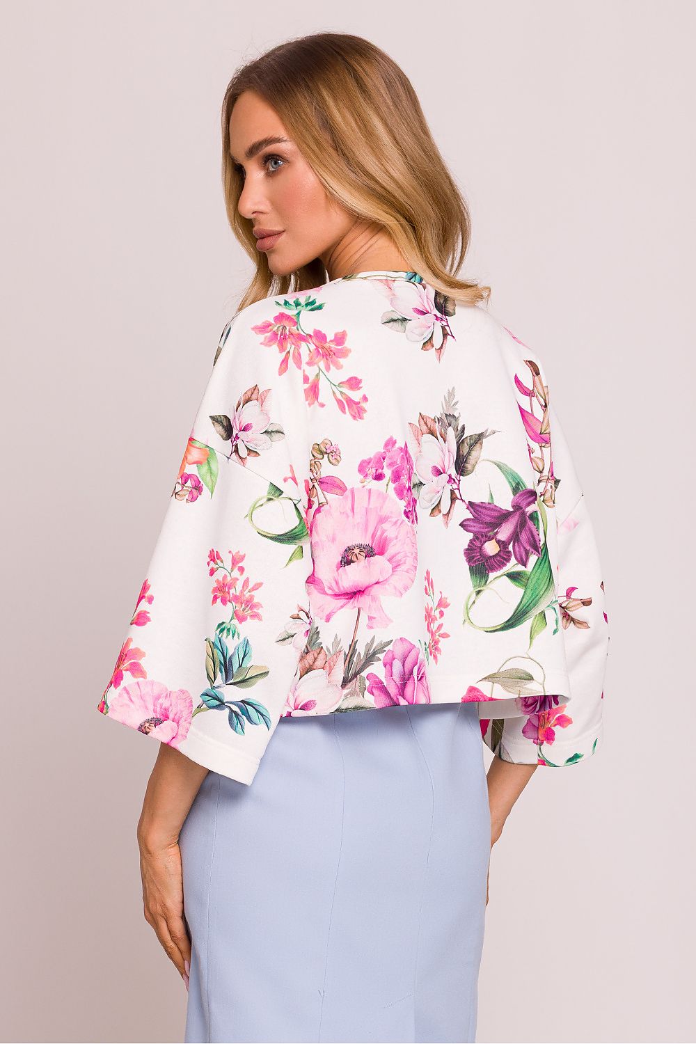 Moe oversized striped knit sweater displayed on a model, highlighting the comfortable fit and stylish boat neck for a chic casual look.